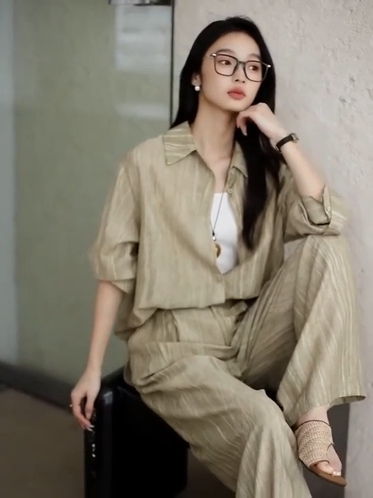 Video showcasing a Women's two-piece crinkled set in Shadow — relaxed silhouette with dropped shoulders and soft texture, ideal for warm urban days. From Borcelleclothes.