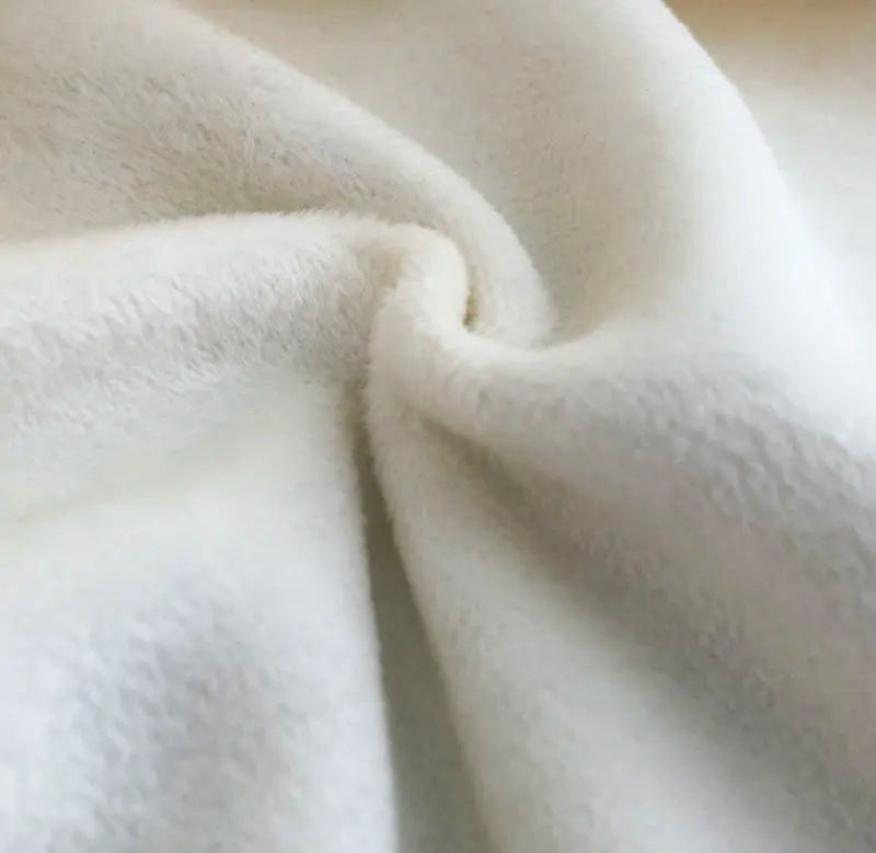 The wrong side of the fabric for the Women's Oversized Single-Sided Fleece Sweatshirt in silver. The image highlights the soft, plush fleece interior, showcasing the cozy and comfortable texture of the fabric designed for warmth and durability. From Borcelleclothes.