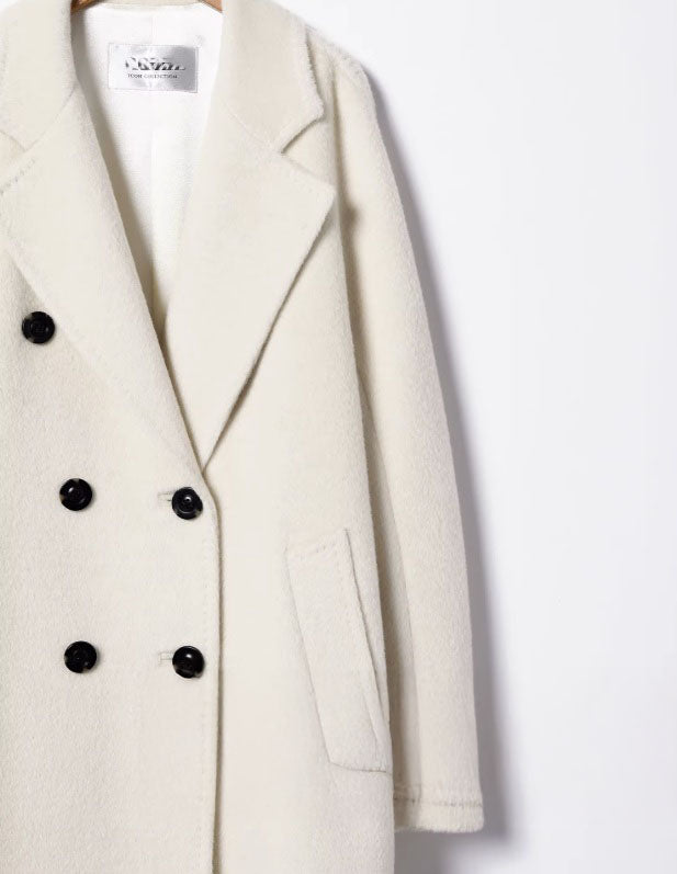 Left section of the Women’s Mid-Calf Alpaca Coat in Orchid White, focusing on the seamless construction and soft alpaca fabric. From Borcelleclothes.