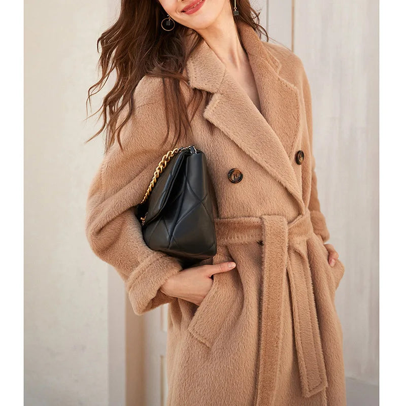 Women's Mid-Calf Alpaca Coat in Pale Taupe, showcasing the elegant double-breasted design, seamless kimono sleeves, and luxurious Suri alpaca and cashmere blend with a soft fur-like texture. From Borcelleclothes.