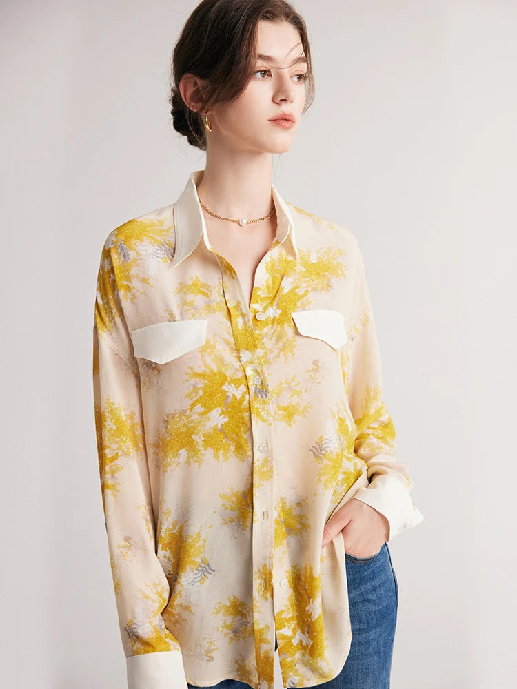 Model with hand in jeans pocket, wearing women's 100% Mulberry Silk Mimosa Print Shirt. From Borcelleclothes.