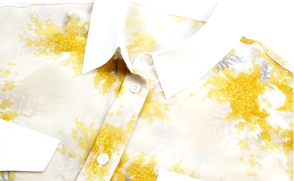 Detailed stitching and textured fabric on the contrast collar of a Women's 100% Mulberry Silk Shirt with Mimosa Print in Dawn Pink, featuring contrast collar, bold accents, and a flowing silhouette. From Borcelleclothes.