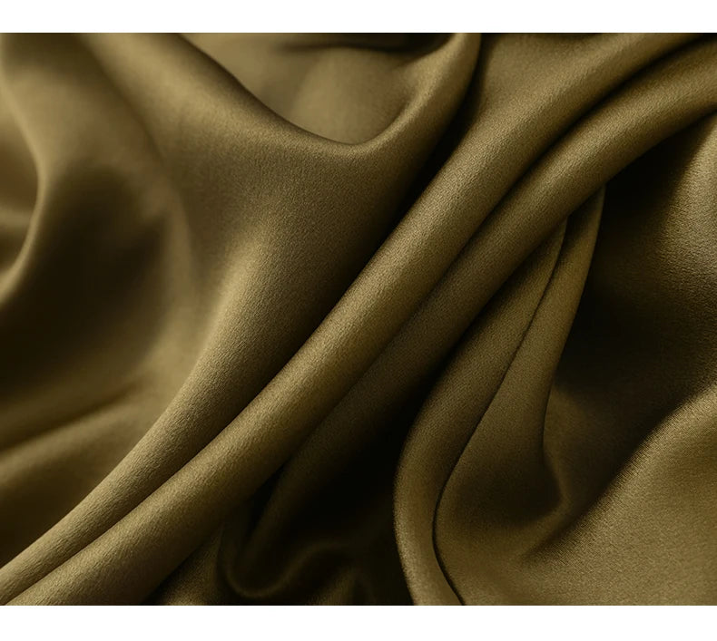 Draped 22 Momme silk fabric in Himalaya tone, showing texture and weight of the skirt. From Borcelleclothes.