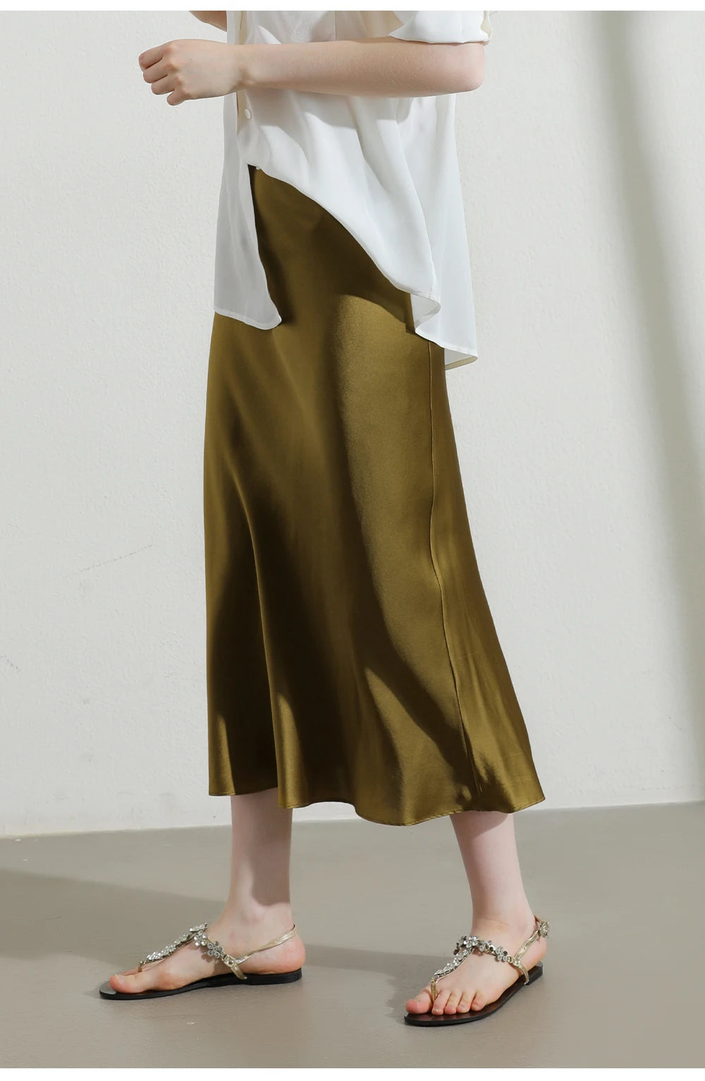 Model in Himalaya silk skirt styled with untucked top for a relaxed, effortless look. From Borcelleclothes.