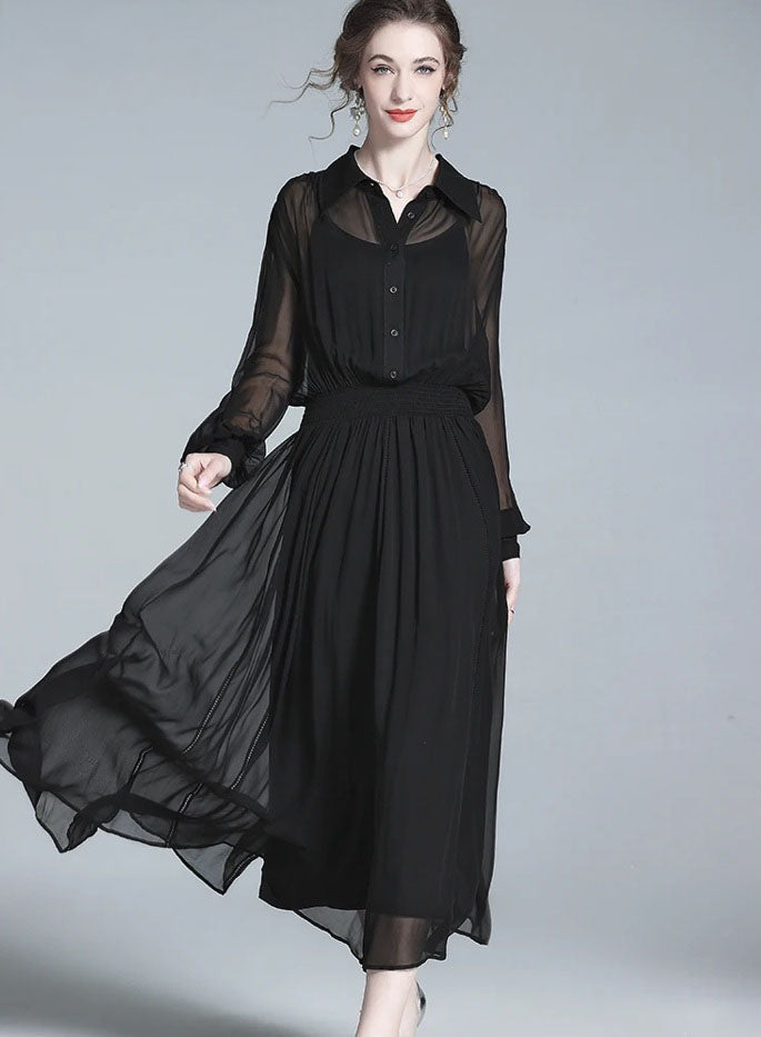 Model walking in black silk dress, fabric moving with lightness. From Borcelleclothes.