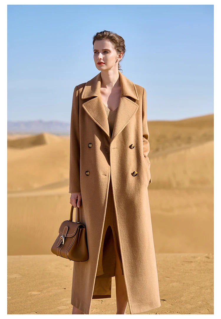 Model wearing the Women's 7/8 Cashmere Blend Coat in French Beige, holding a bag, showcasing its timeless neutral hue and elegant design. From Borcelleclothes.