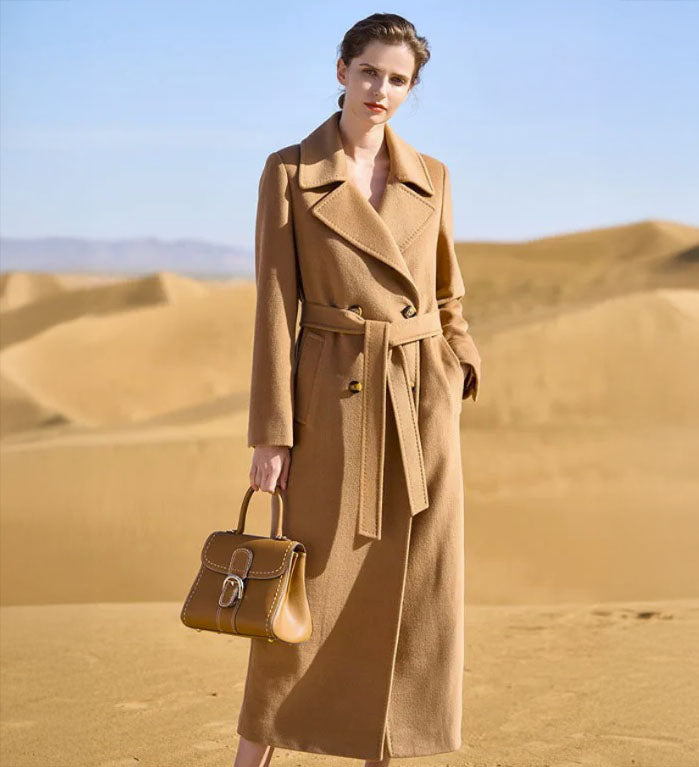 Women's 7/8 Cashmere Blend Coat in French Beige, featuring a double-breasted design, classic notch lapels, an adjustable waist belt, and single-welt pockets, crafted from a blend of cashmere, high-count wool, and Mulberry silk for refined elegance and luxurious comfort. From Borcelleclothes.