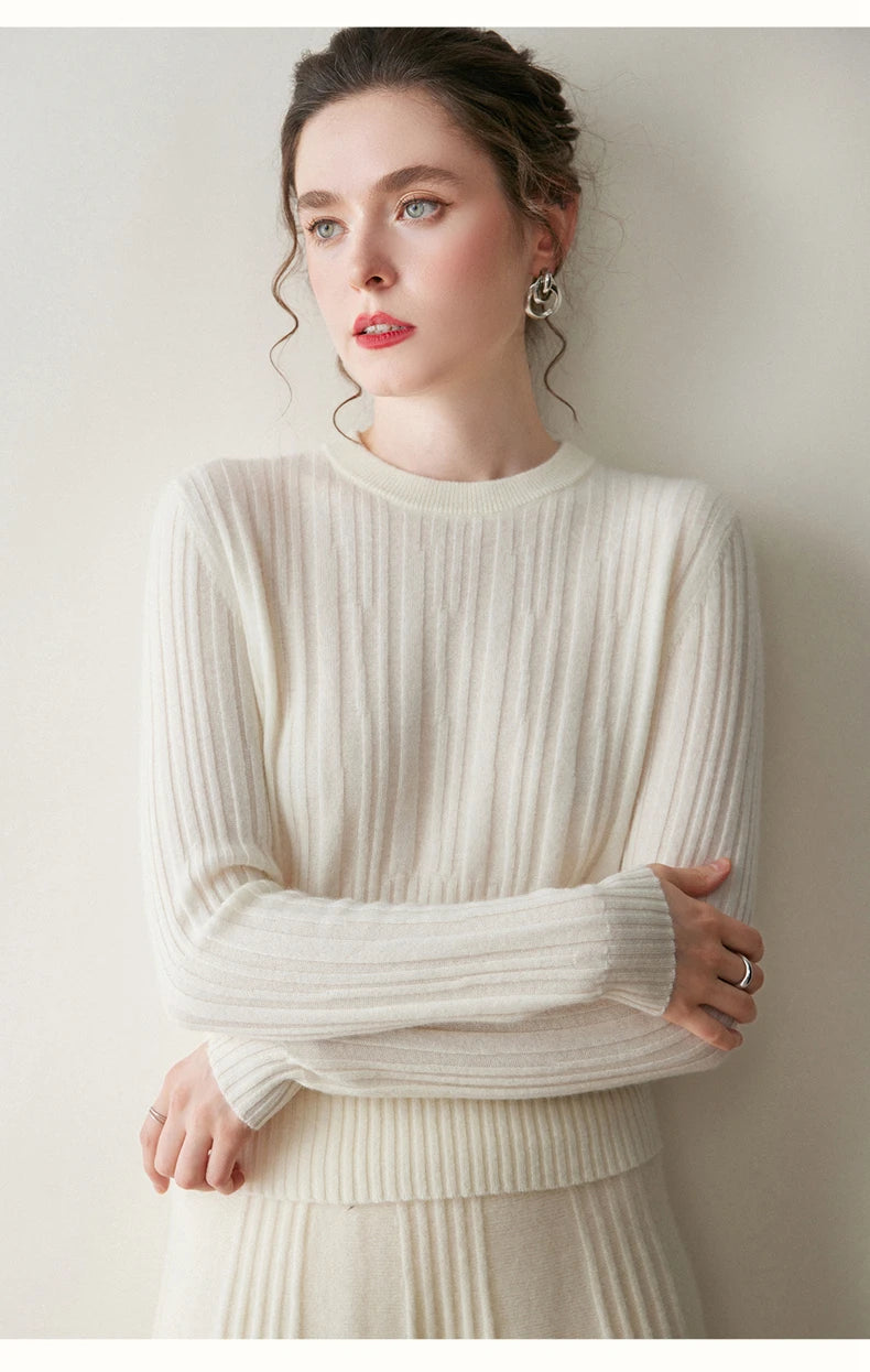 Model in Pearl Bush cashmere sweater with arms crossed at the waist — From Borcelleclothes.