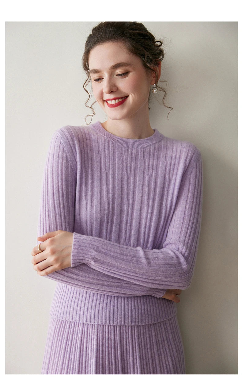 Model in Wisteria Purple cashmere sweater with arms crossed at the waist — From Borcelleclothes.