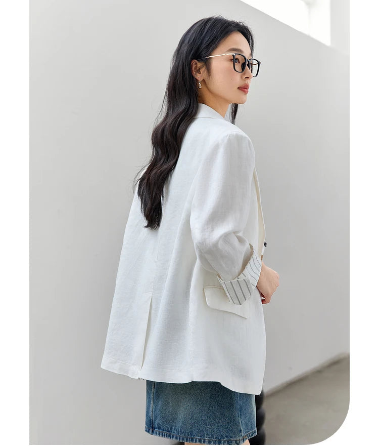 Back view of a woman wearing the Alabaster Urban Blazer. From Borcelleclothes.