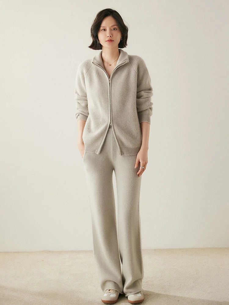 Standing model wearing Pale Silver Alashan cashmere cardigan with hand in pocket — From Borcelleclothes.