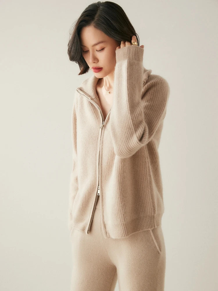 Model adjusting hair in Vanilla Alashan cashmere cardigan — From Borcelleclothes.