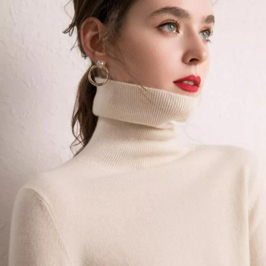 Women's Alashan Cashmere Turtleneck Sweater in Pearl Bush, crafted from the finest cashmere fibers from Inner Mongolia. Featuring a slim fit, stockinet stitches, and ribbed turtleneck, cuffs, and hems for a sleek and sophisticated design, Borcelleclothes.