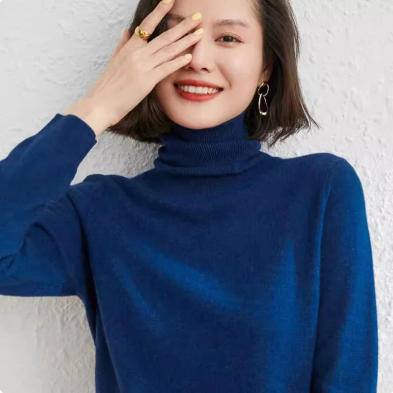 Women's Alashan Cashmere Turtleneck Sweater in Regal Blue, crafted from the finest cashmere fibers from Inner Mongolia. Featuring a slim fit, stockinet stitches, and ribbed turtleneck, cuffs, and hems for a sleek and sophisticated design, Borcelleclothes.