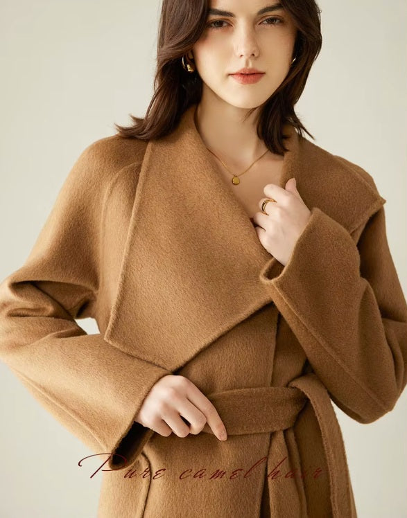 The upper part of the Women's Asymmetrical Camel Hair Coat in Bourbon, highlighting its sculpted asymmetrical lapels and refined tailoring. From Borcelleclothes.
