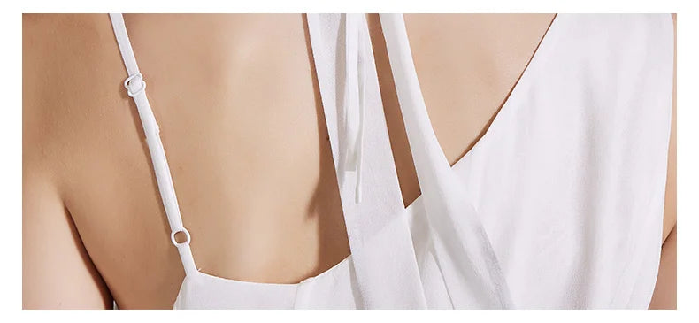 Close-up of the back shoulder section of the dress, revealing the smooth drape and construction detail. From Borcelleclothes.