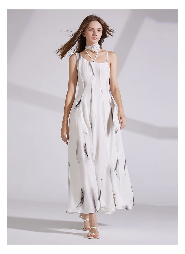 Model stepping forward in platinum silk georgette dress, revealing the fluidity of the layered construction. From Borcelleclothes.