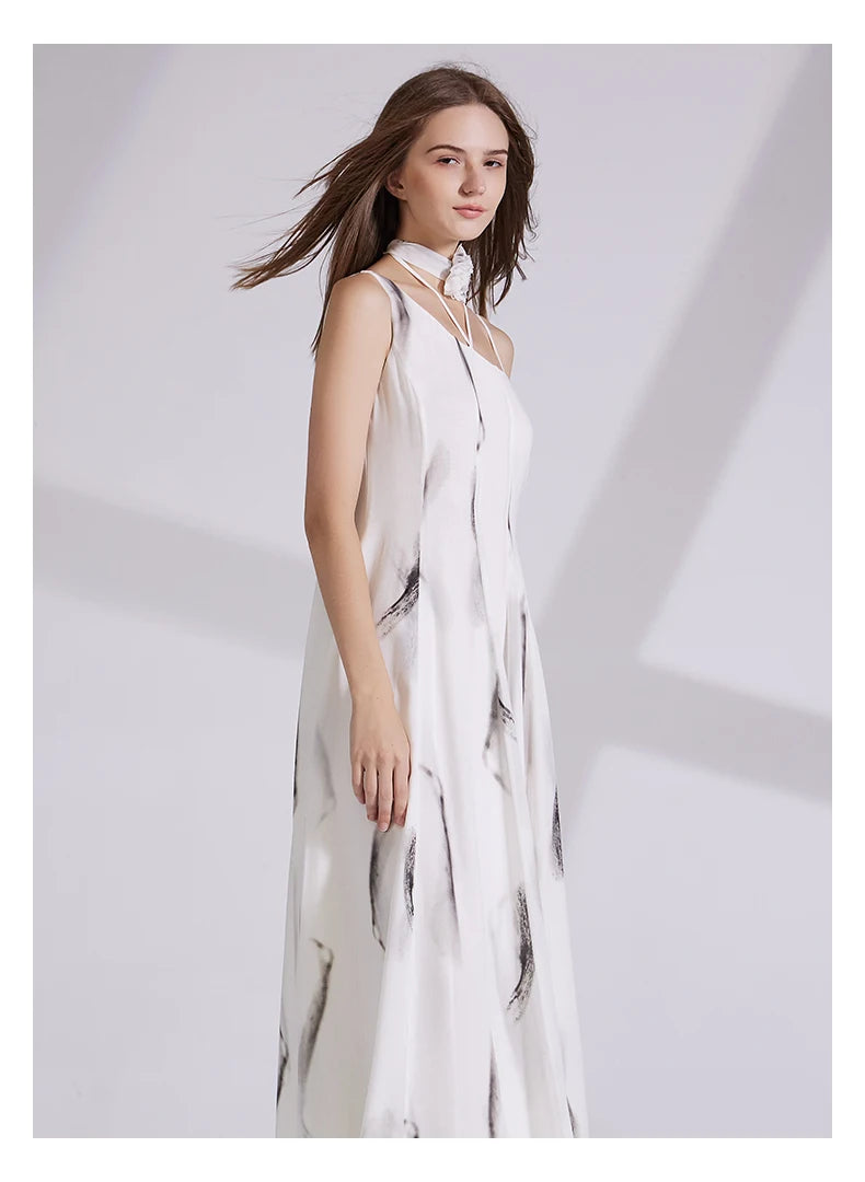 Model turned slightly to the side in platinum silk georgette dress, revealing the one-shoulder silhouette and flowing drape. From Borcelleclothes.