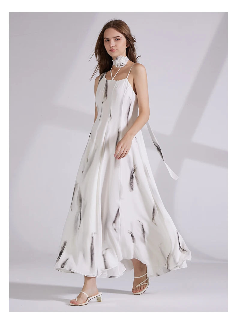 Side profile of the model walking right, dress draping in graceful motion. From Borcelleclothes.