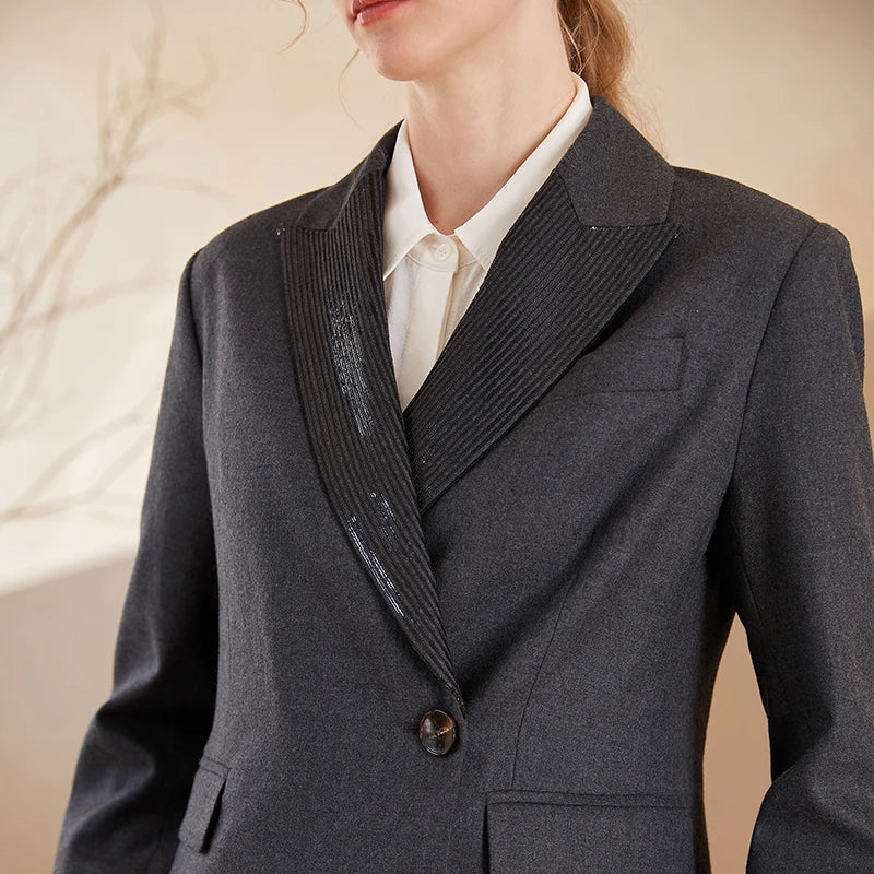 Upper part of women’s Australian wool blazer in Davy Grey with chain detail. From Borcelleclothes.