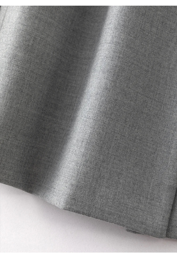 Back vent detail of women’s Australian wool blazer in Mountain Mist with chain trim. From Borcelleclothes.