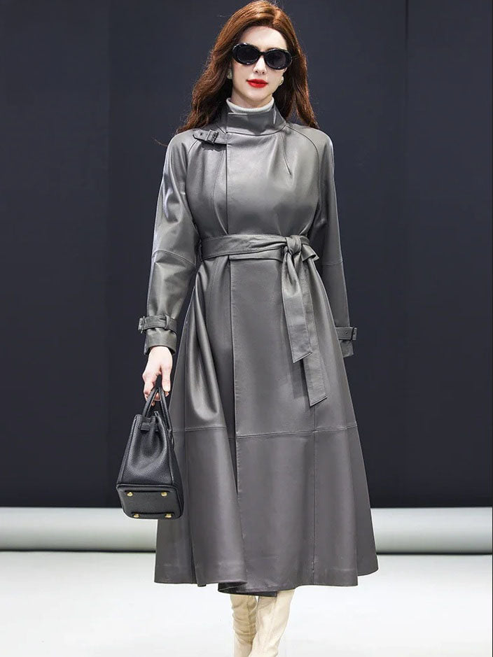 Women's Avant-Garde Wrap Coat in Monsoon. Model holds a structured handbag, highlighting the coat’s sophisticated drape and commanding elegance. Borcelleclothes.