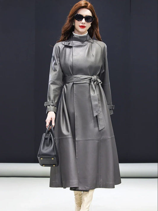 Women's Avant-Garde Wrap Coat in Monsoon. Model holds a structured handbag, highlighting the coat’s sophisticated drape and commanding elegance. Borcelleclothes.