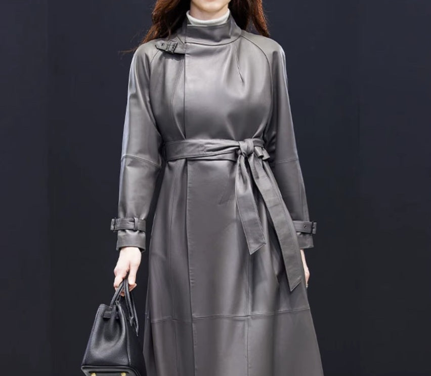 Women's Avant-Garde Wrap Coat in Monsoon. Midsection view highlighting the sculptural waist design and intricate leather craftsmanship. Borcelleclothes.