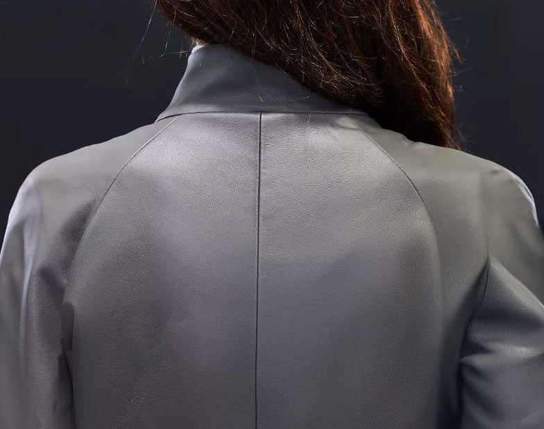 Women's Avant-Garde Wrap Coat in Monsoon. Back view highlighting the structured collar, reinforcing the coat’s architectural elegance. Borcelleclothes.