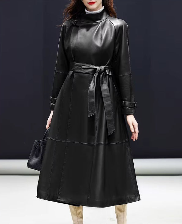 Women's Avant-Garde Wrap Coat in Onyx. Model steps forward, displaying the coat’s powerful drape and precise tailoring. Borcelleclothes.
