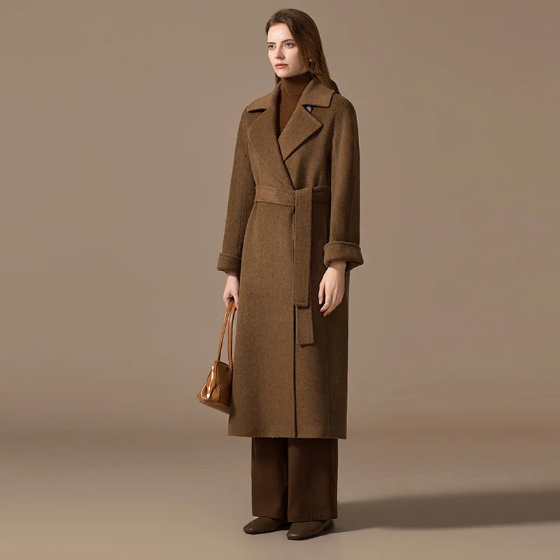 Women's Bactrian Camel Hair Coat in Irish Coffee—crafted from sustainably sourced Bactrian camel hair for exceptional warmth and softness. Featuring princess seams, a streamlined three-panel sleeve design, and a tailored silhouette, this coat blends luxury with refined craftsmanship. From Borcelleclothes.