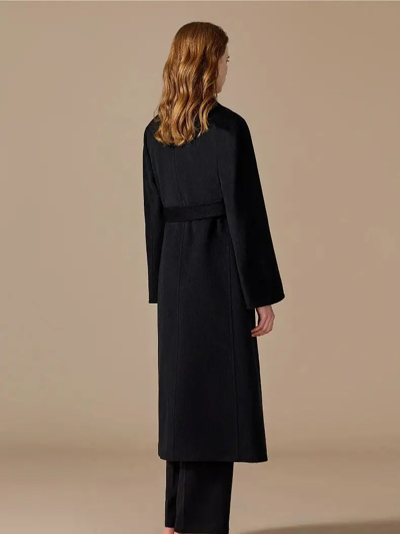Back of the Women's Bactrian Camel Hair Coat in Onyx, showcasing its sculpted princess seams and flowing silhouette. From Borcelleclothes.