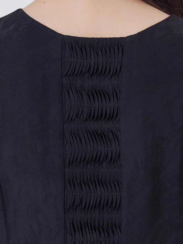 Back upper view of the women's Baltic Sea silk dress highlighting structured tuck panel. From Borcelleclothes.