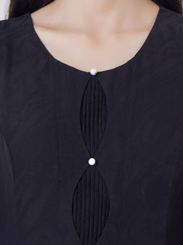 Front upper view of the women's Baltic Sea silk dress with curved panel and pleated detailing. From Borcelleclothes.