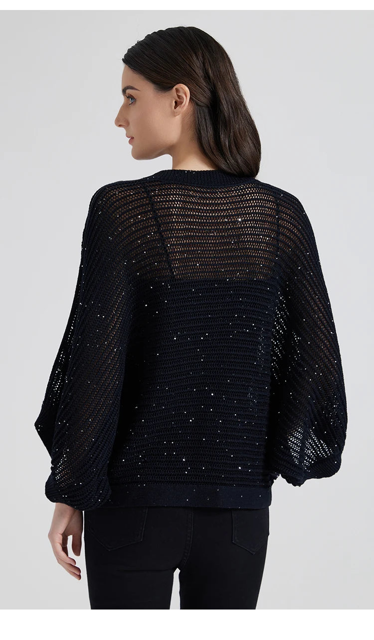 Back view of the Onyx batwing linen mesh top, airy knit structure framing the shoulders and waistline in shadowed tones. From Borcelleclothes.