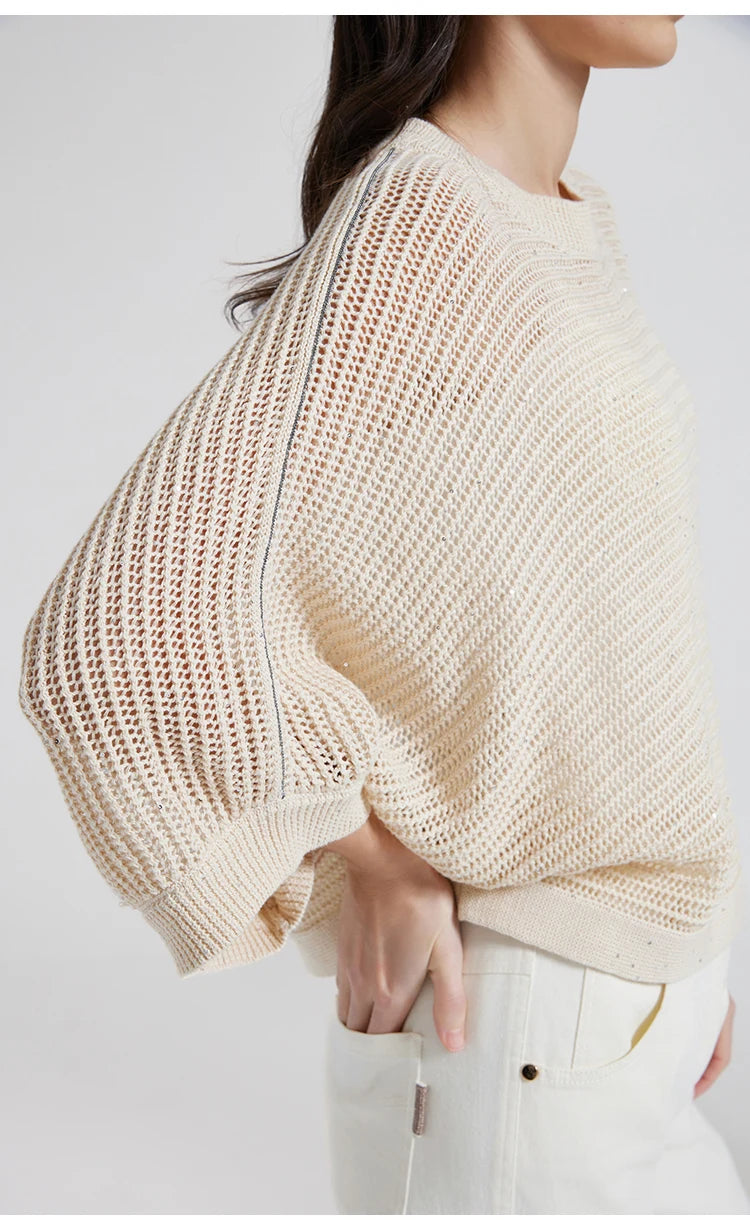 Side profile of woman in Spring Wood mesh top, airy batwing silhouette flowing gently from shoulder to hem. From Borcelleclothes.