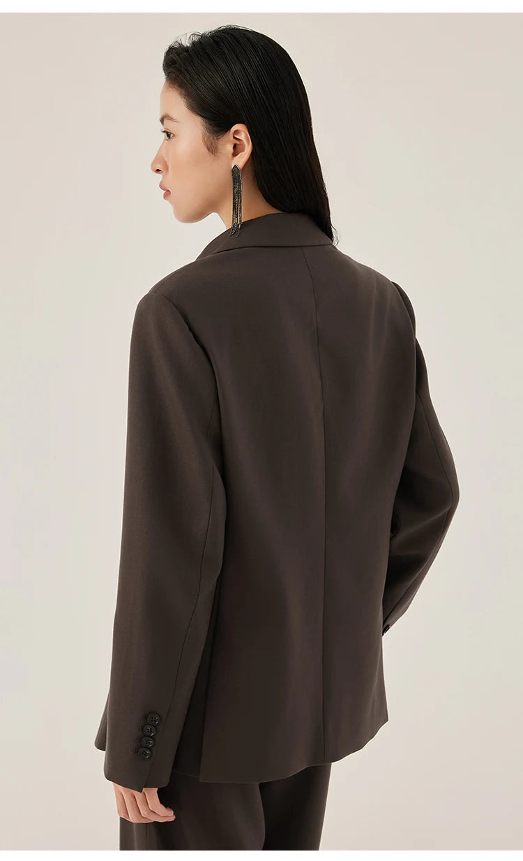 Back view of woman wearing black chocolate blazer with rhinestone fringe detail – from Borcelleclothes.