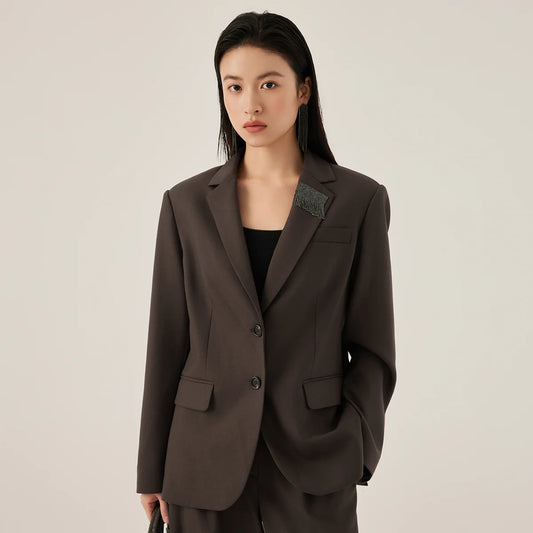 Women’s black chocolate blazer with rhinestone fringe detail on lapel – from Borcelleclothes.