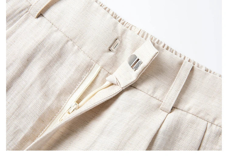 Detail of the Bon Jour trousers with zipper fly partially unzipped, showing closure structure. From Borcelleclothes.