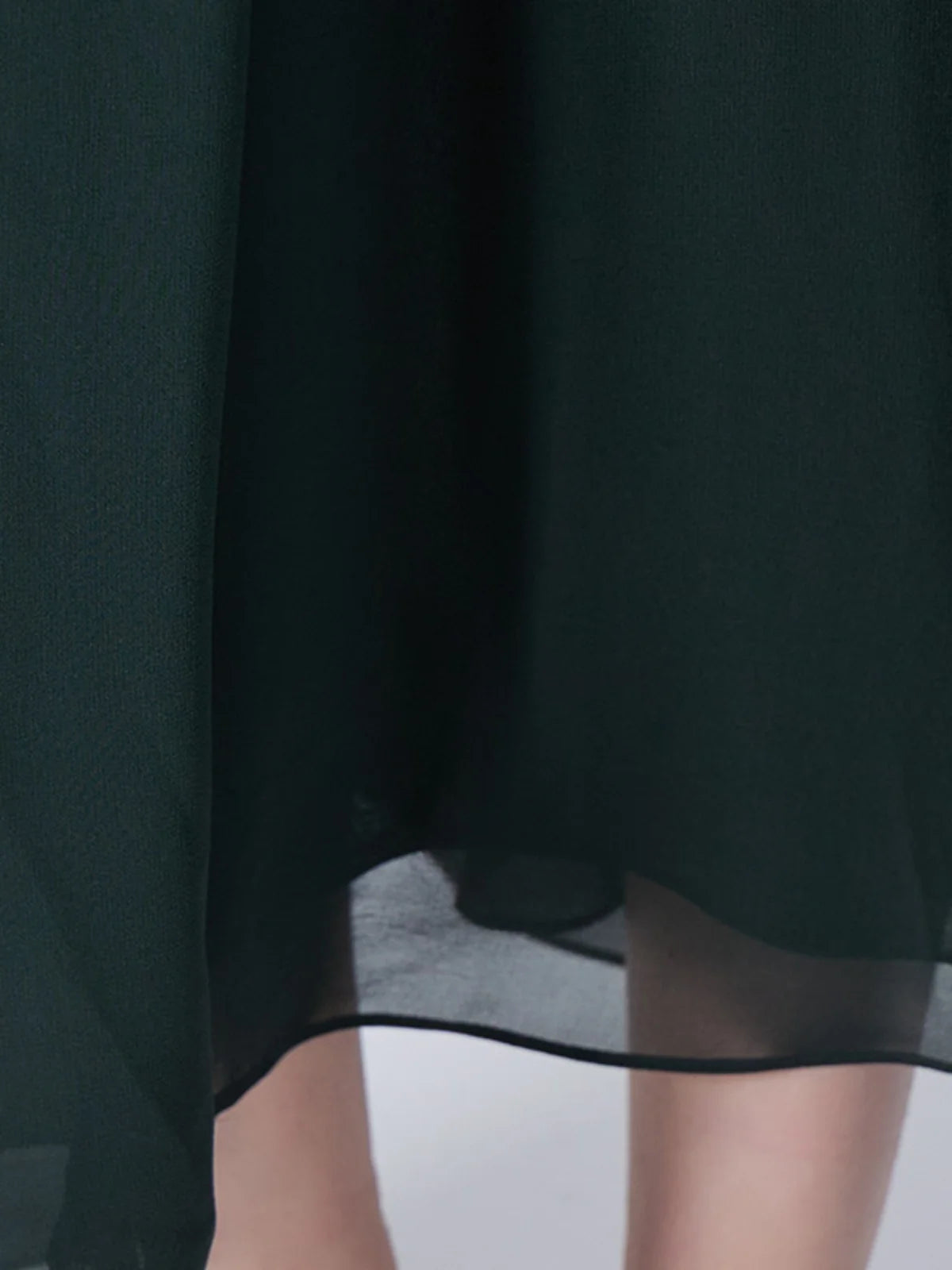 Lower section of the Lunar Green silk dress with flowing draping. From Borcelleclothes.