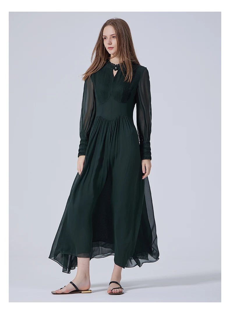 Model in the Lunar Green dress with foot put side, revealing the lightness of the sheer sleeves and flow of silk chiffon. From Borcelleclothes.