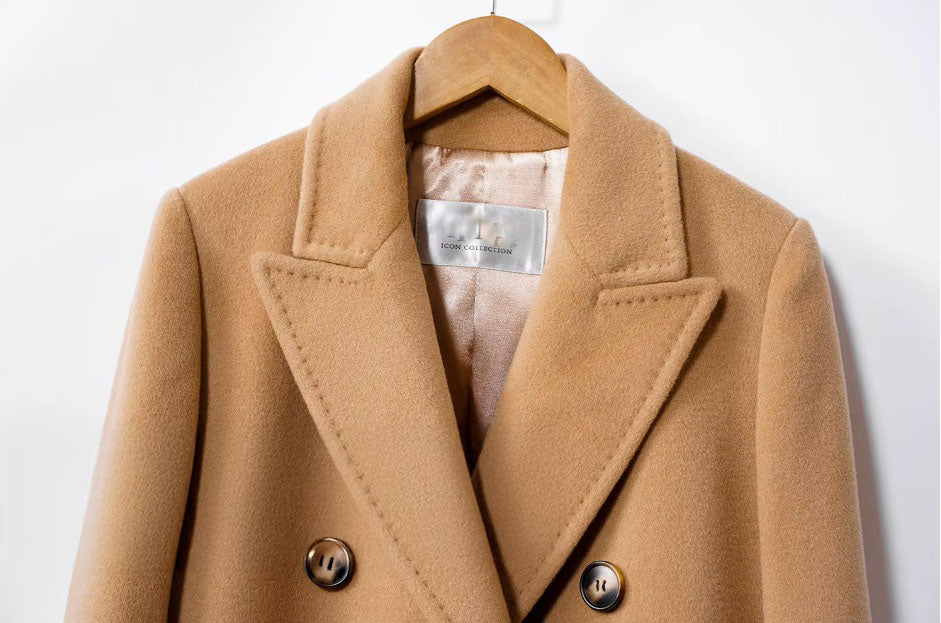 Upper part of the Women's Cashmere Blend Long Coat in Clay Brown, featuring a minimalist double-breasted design with six aligned buttons. From Borcelleclothes.