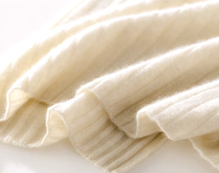 Bottom of a Women's Cashmere Midi Dress in Merino, highlighting the clean hemline and ribbed texture. From Borcelleclothes.