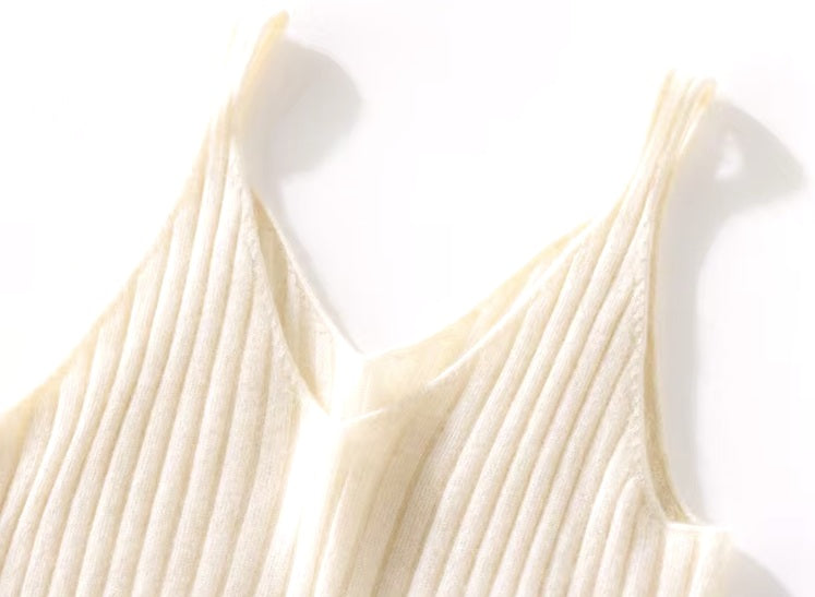 The upper design of a Women's Cashmere Midi Dress in Merino, featuring wide ribbing and a refined V-neckline. From Borcelleclothes.