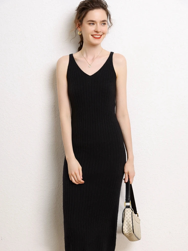 Model wearing a Women's Cashmere Midi Dress in Onyx, showcasing the elegant V-neck design and ribbed cashmere texture. From Borcelleclothes.