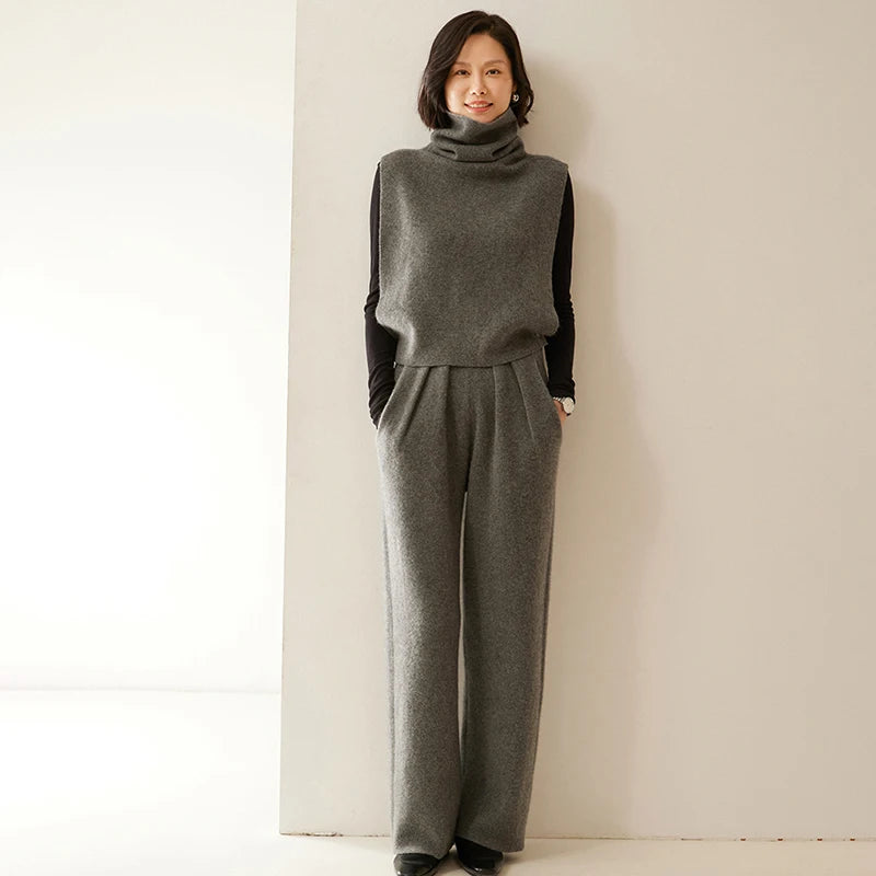 Model wearing Flint pleated cashmere trousers and matching sweater — From Borcelleclothes.