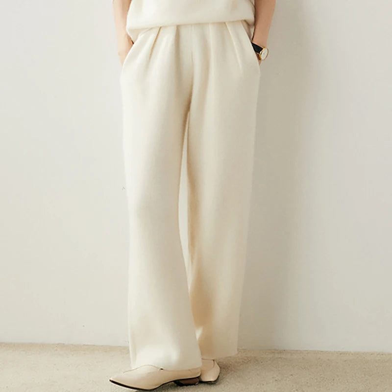 Women's Cashmere Pleated Trousers in Pearl Bush, with four front pleats and a structured waistband — From Borcelleclothes.