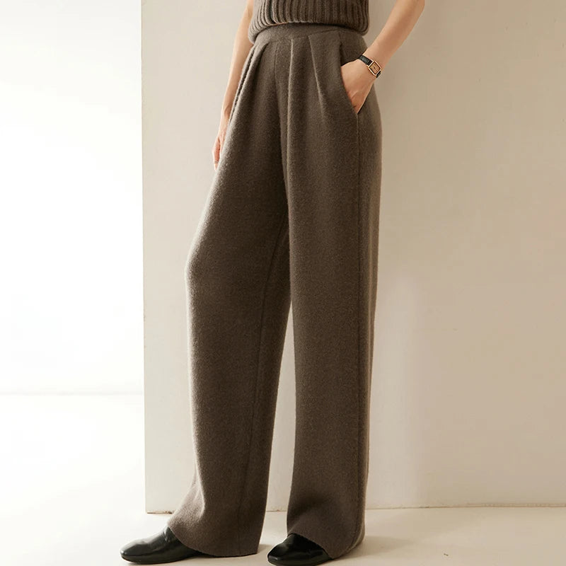 Women's Cashmere Pleated Trousers in Umber, with four front pleats and a structured waistband — From Borcelleclothes.