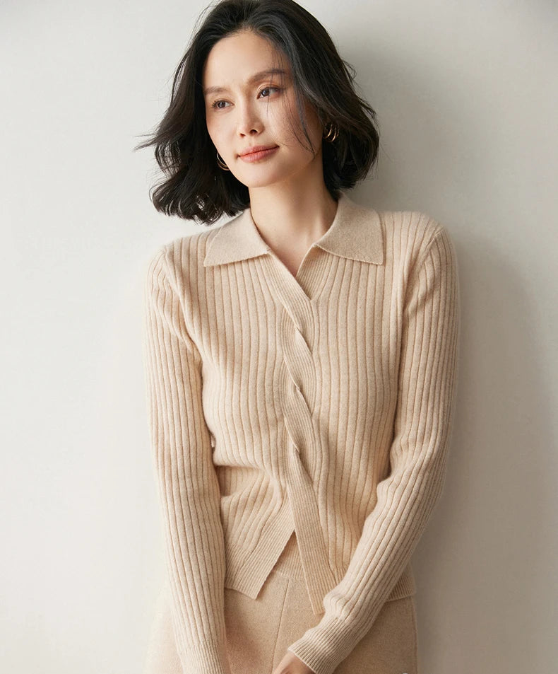 Model looking to the side in women’s cashmere rib sweater in Pale Taupe — From Borcelleclothes.
