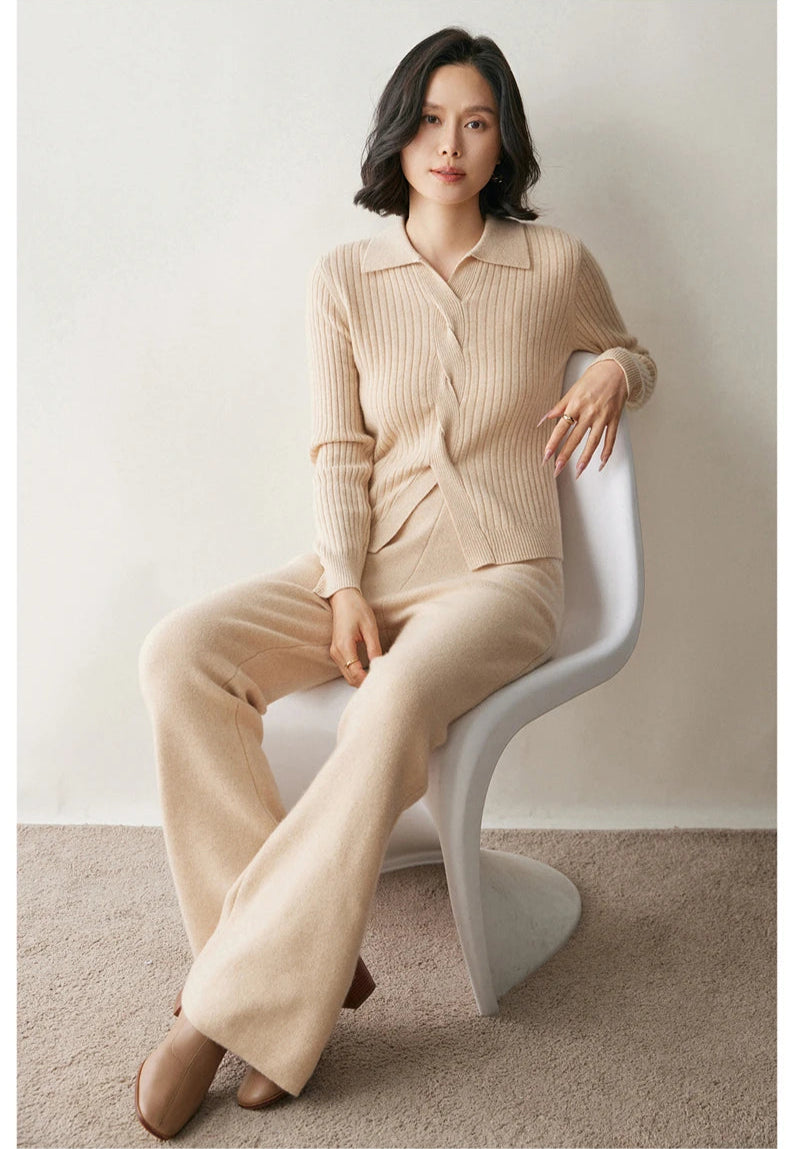 Model sitting on chair wearing women’s cashmere rib sweater in Pale Taupe — From Borcelleclothes.
